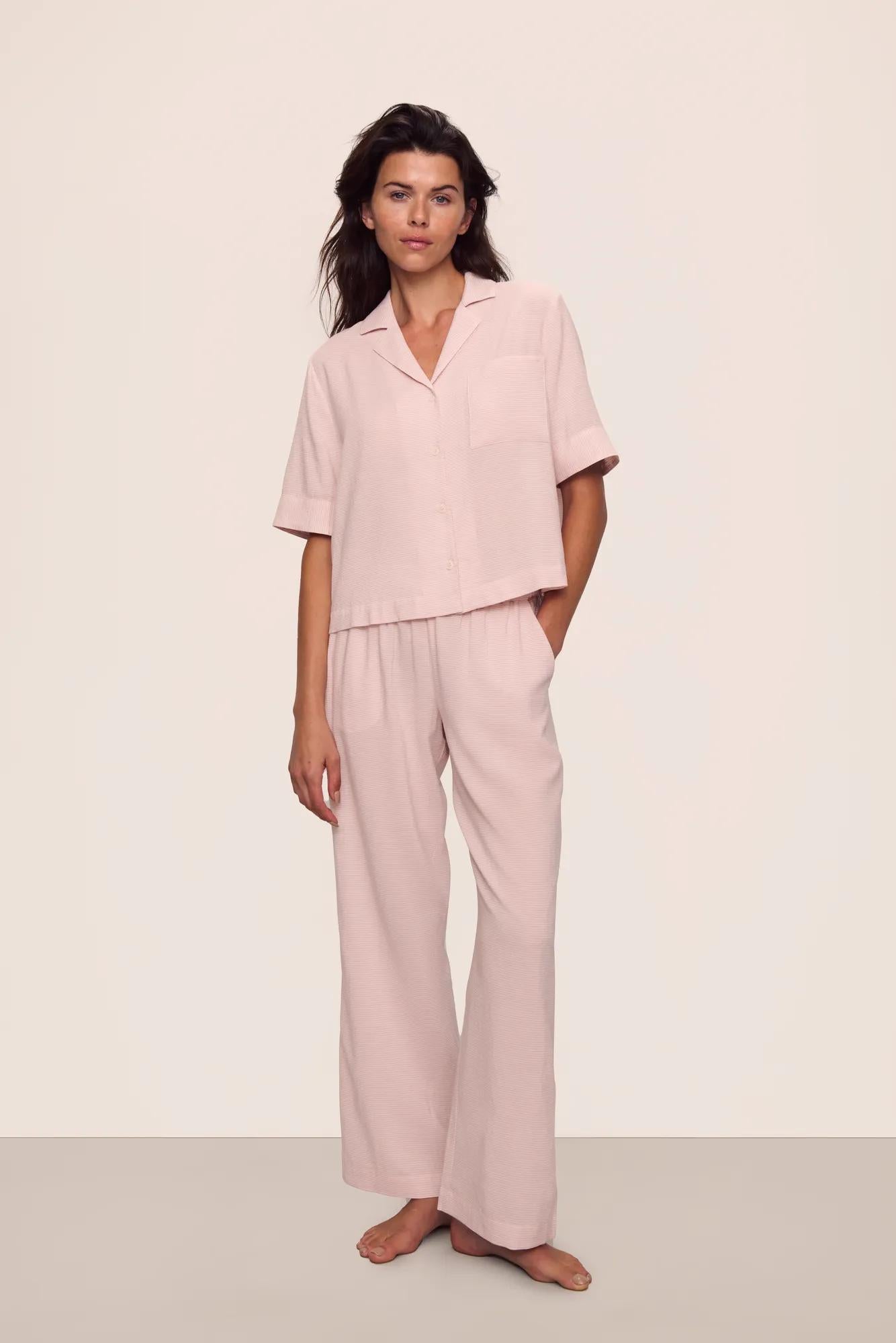 Model is wearing Nautico Relaxed Short Sleeve & Pant PJ Set in  Feeder Stripes Pale Mauve/White