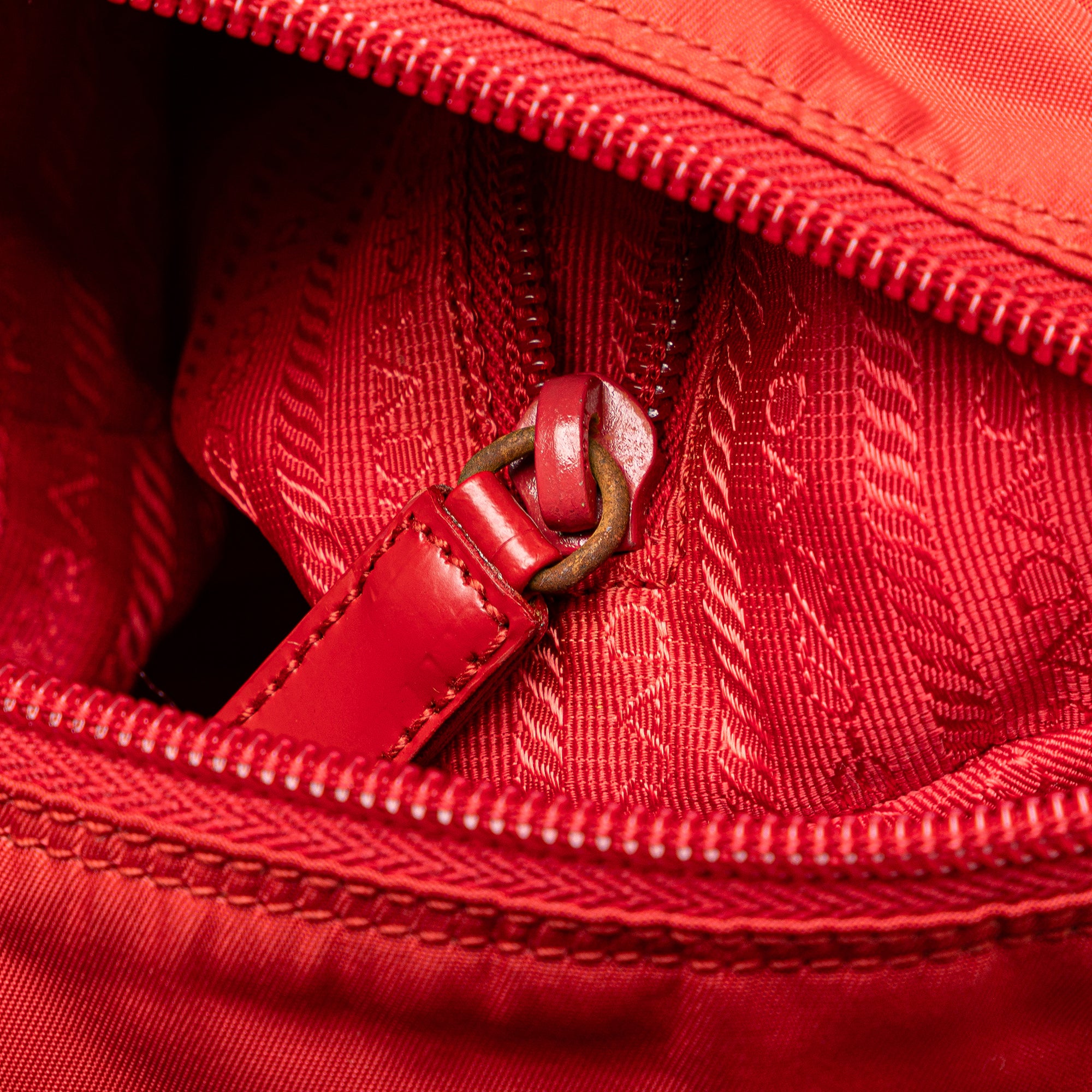 Prada | Pre-Owned Tessuto Zip Buckle Messenger Bag | Red