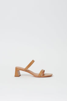 Tan leather sandal with debossed quilted pattern, ankle strap, and chunky block heel.
