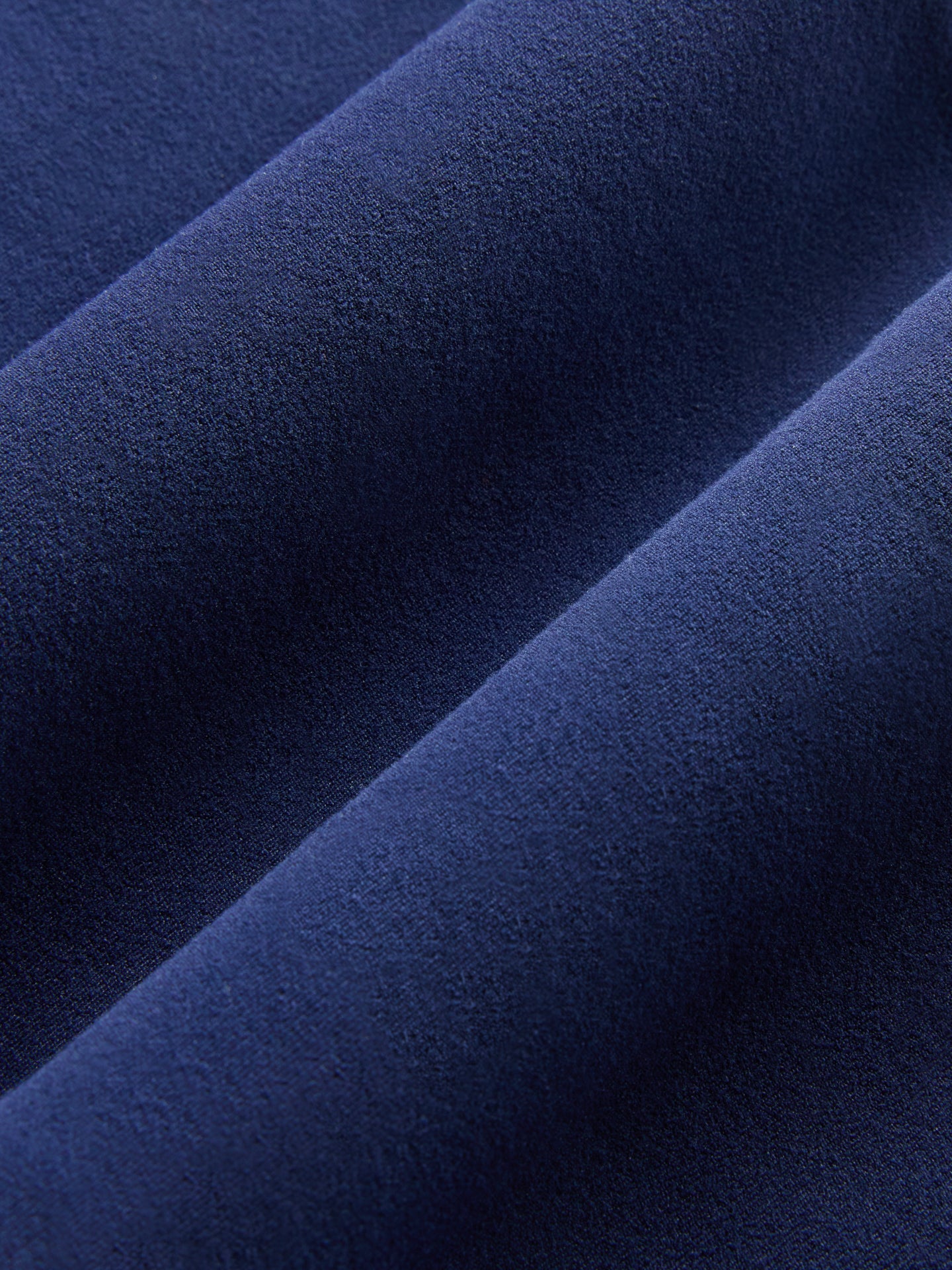 Close-up fabric texture of Melt in navy blazer.