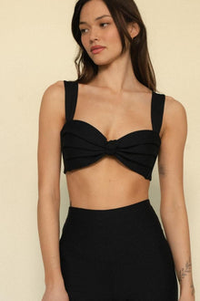 Black bikini top with pleated sweetheart neckline, wide straps, and twisted center detail.