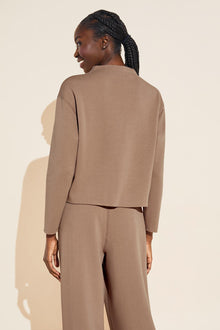 Model wears Reversible Plush Funnel Neck Top in mocha.