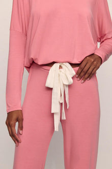 Model is wearing Gisele TENCEL Modal Slouchy PJ Set in  Sunkissed Coral/Ivory