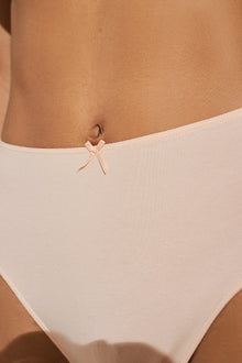 Model wears Pima Stretch Cotton Highwaist Brief in Buff.