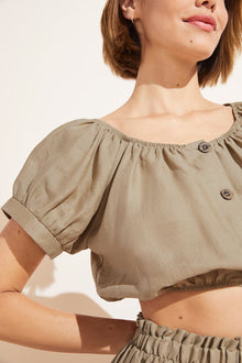 Model wears Harper Linen Top in khaki.