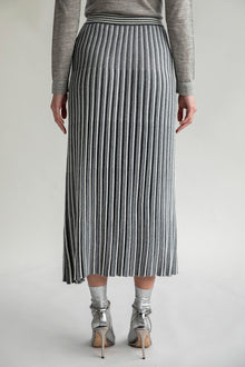 Back view of the Adeline Skirt, highlighting the pleated details and contrasting stripe design.
