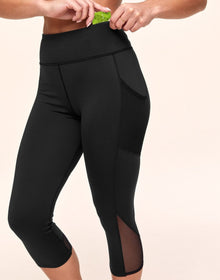 Adore Me Ava Cozy Crop Cozy Active Legging with Pockets & Mesh Details in color Noir and shape legging