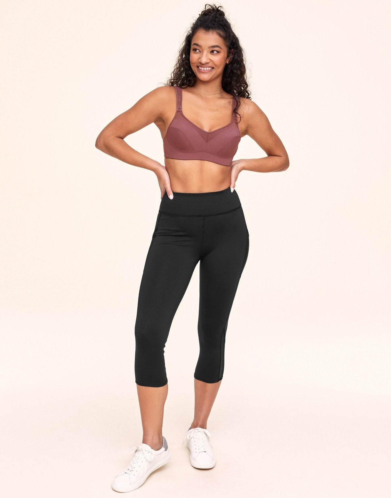 Adore Me Ava Cozy Crop Cozy Active Legging with Pockets & Mesh Details in color Noir and shape legging