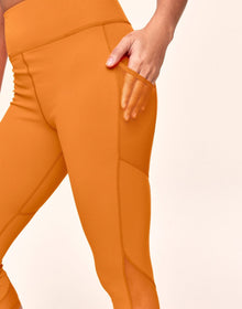 Adore Me Ava Cozy Crop Cozy Active Legging with Pockets & Mesh Details in color Spooky and shape legging