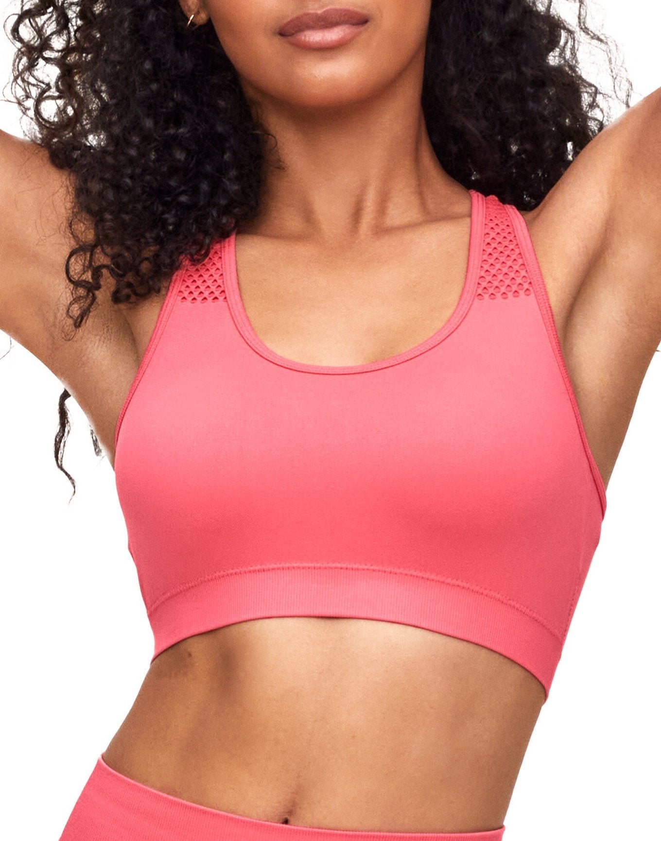 Adore Me Skylar Seamless Bra Seamless Bra in color Sunkist Coral and shape sports bra