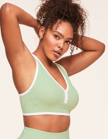 Adore Me Tori Plunge Sports Bra Low-Impact Sports Bra in color Reed and shape sports bra