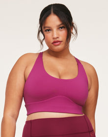 Adore Me Lotus Crossover Bra Lotus Medium Support Sports Bra in color Festival Fuchsia and shape sports bra