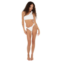 Model wearing the Are You Am I Aimi Bikini Bottom in white, styled with matching one-shoulder knotted top, high-waist cut and cheeky fit. **white