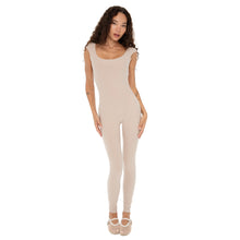 Full-length front view of model in Kaisa Catsuit nude with cap sleeves and ballet-inspired fit. **nude