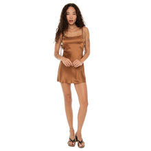 Model wearing the Are You Am I Seraph Dress in silk copper, a mini slip dress with spaghetti straps. **copper