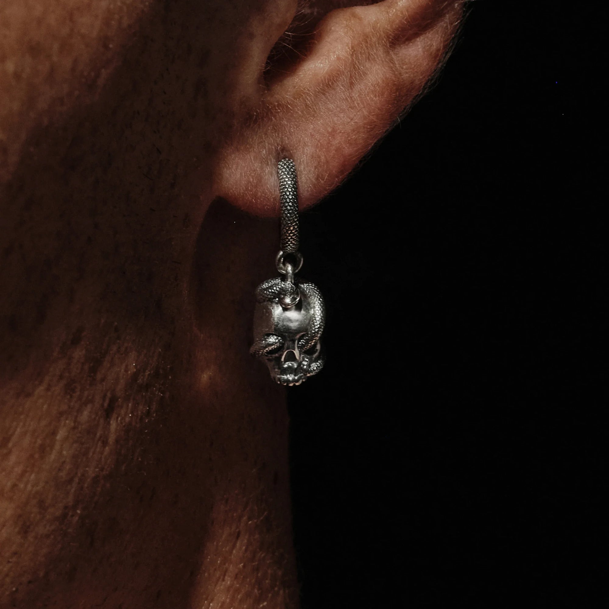 Awe Inspired Earrings Single Serpent Skull Huggie