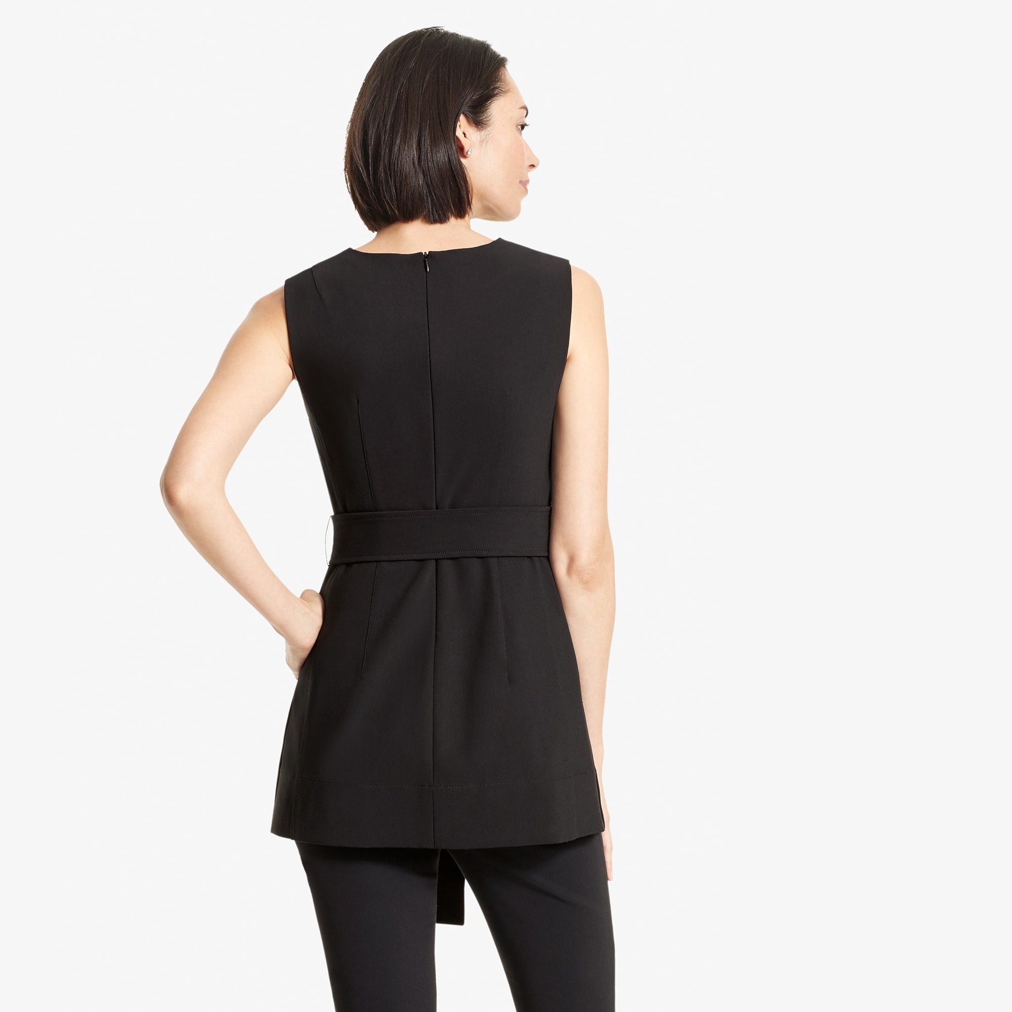 Back image of a woman standing wearing the Angelina top in Black | Exclude