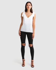 feel-for-you-white-v-neck-top-full-body_fd06ad8f-0215-4314-a9c9-94b10a3e163a.jpg