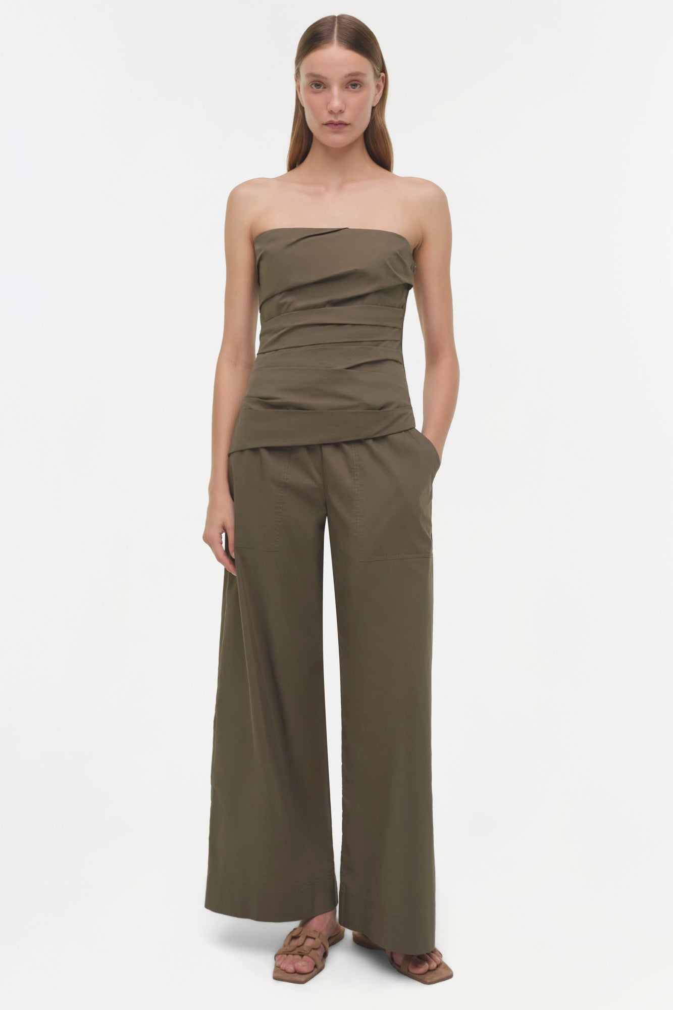 Olive green strapless cotton top with ruched detailing at the torso, paired with wide-leg matching pants.