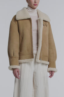Model is Wearing the Nour Hammour Portia Modern Shearling Aviator Jacket Biscuit - Video Close-Up