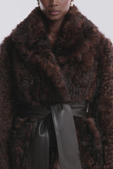 Model is wearing the Nour Hammour Noa Curled Shearling Coat Bourbon - Video