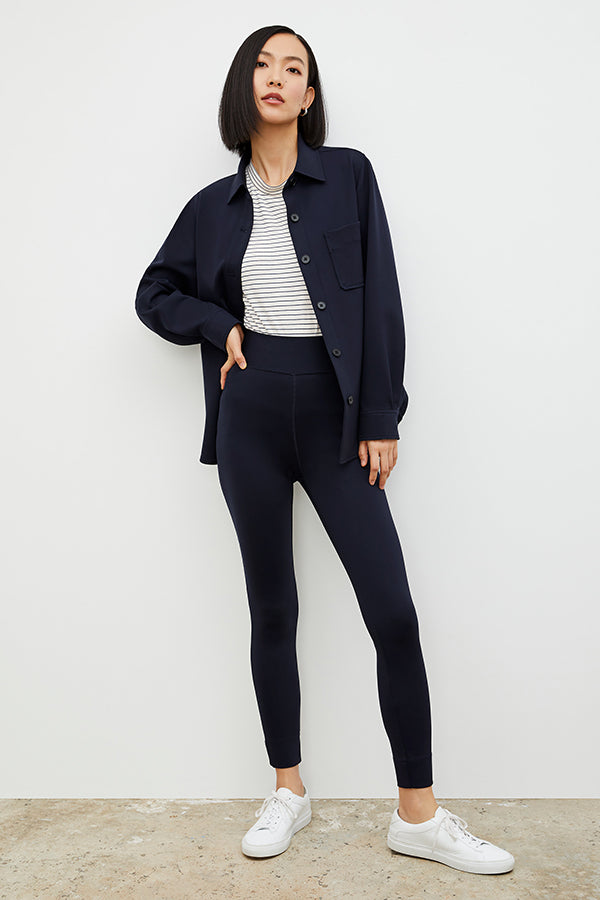 Front image of a woman wearing the Harrington Legging - Light Scuba in Space Blue| Grid | Exclude